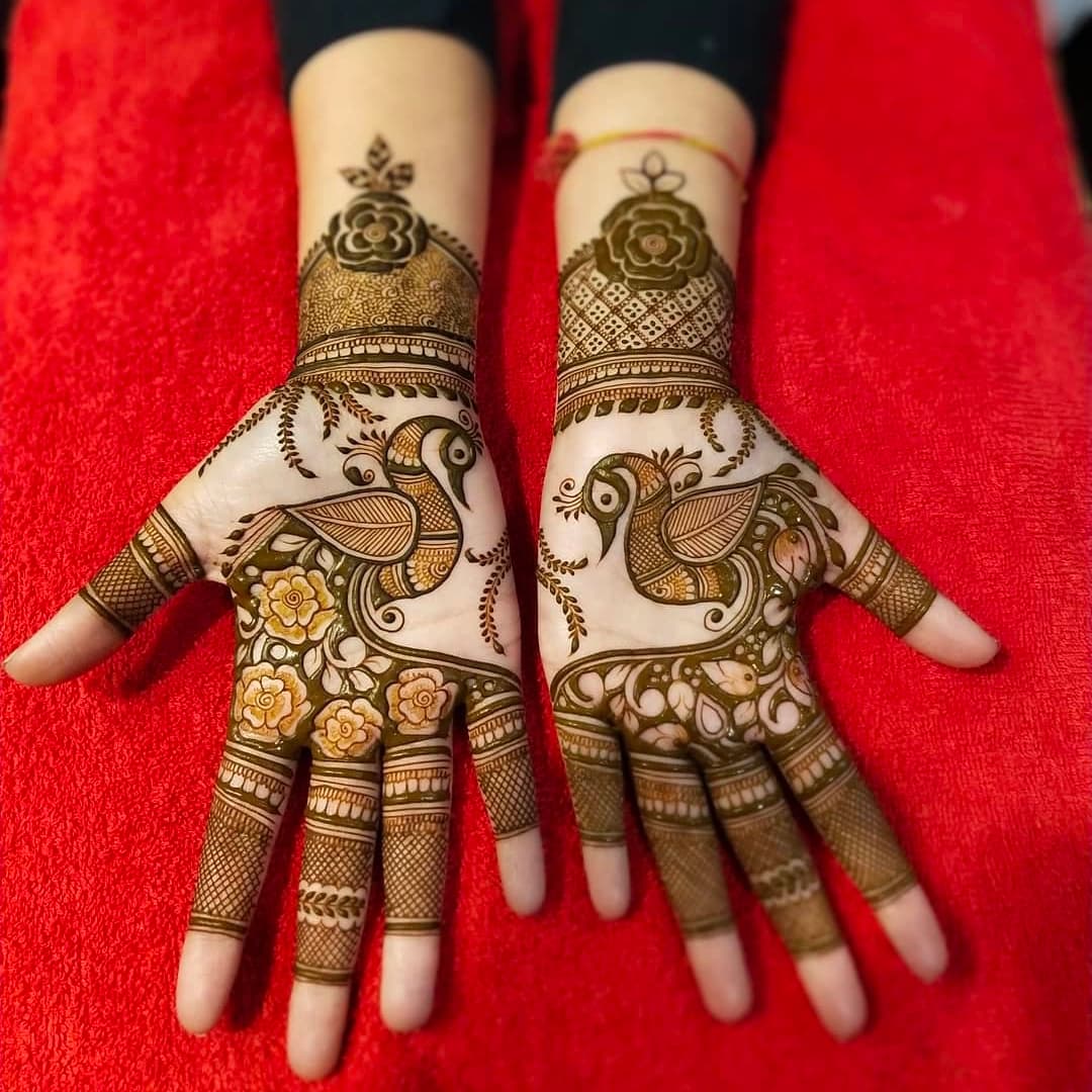 Beautiful 3D bridal mehndi featuring bride and groom illustration with floral details