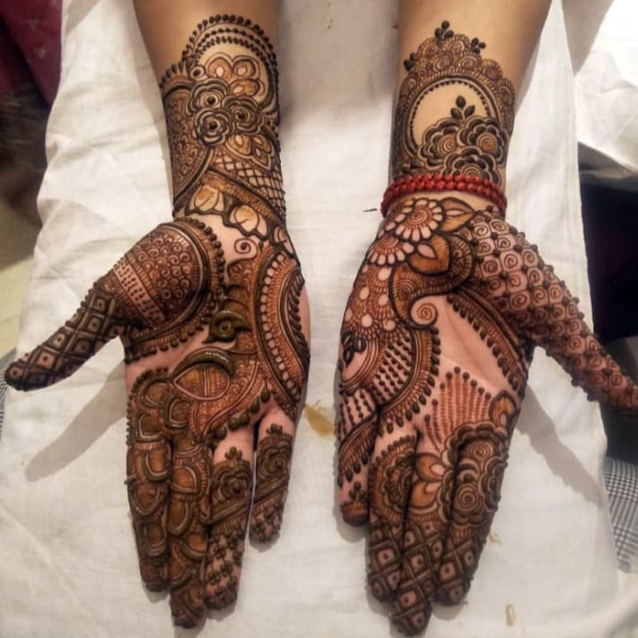 Premium 3D bridal mehndi design with rich floral artwork and detailed fingertips