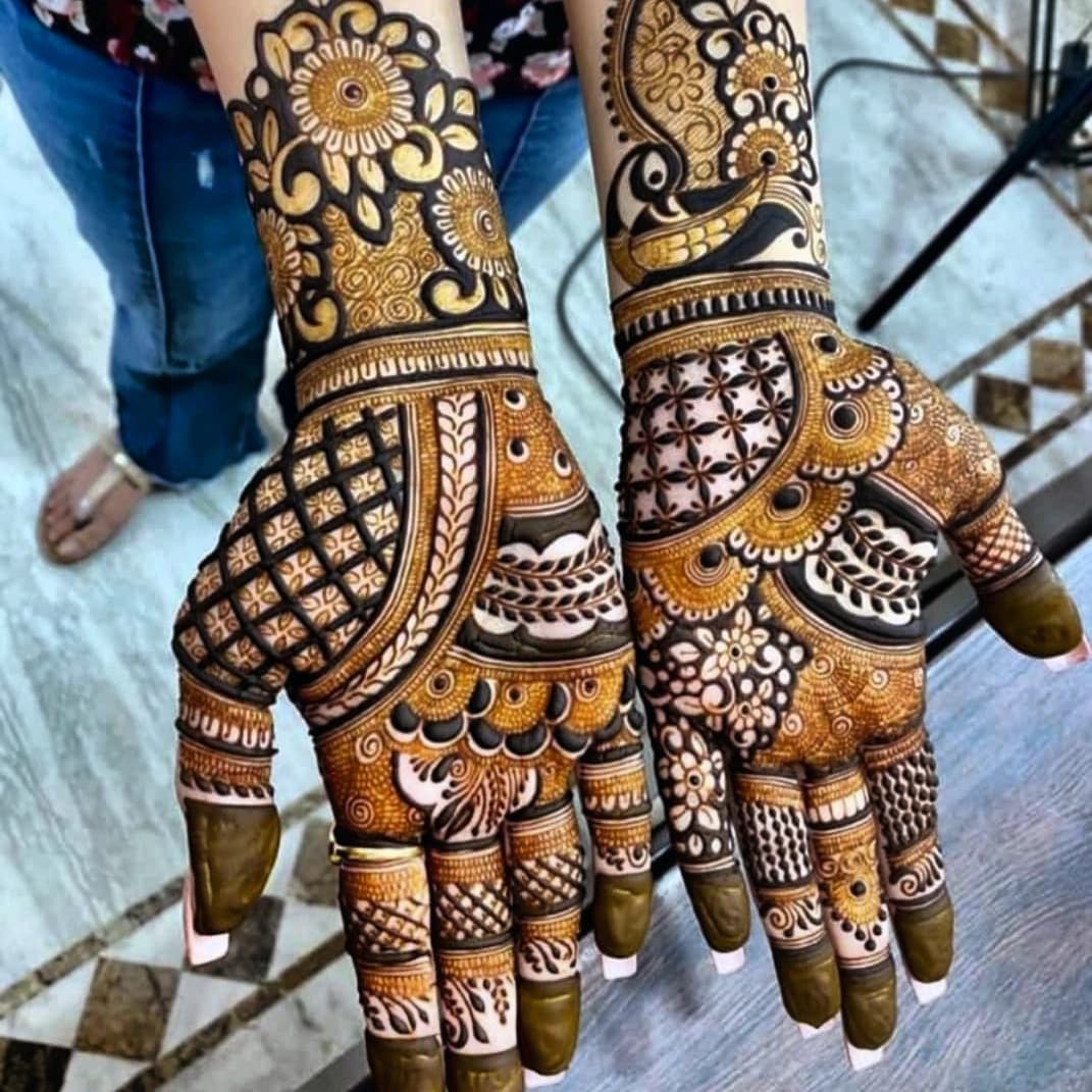 Bridal 3D mehndi featuring dense ornamental patterns and decorative wrist design