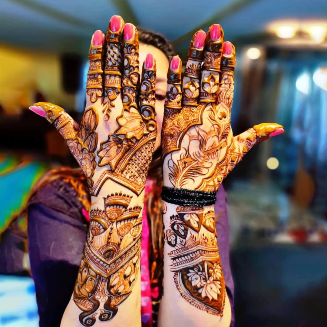 Simple festive mehndi design with floral mandala artwork