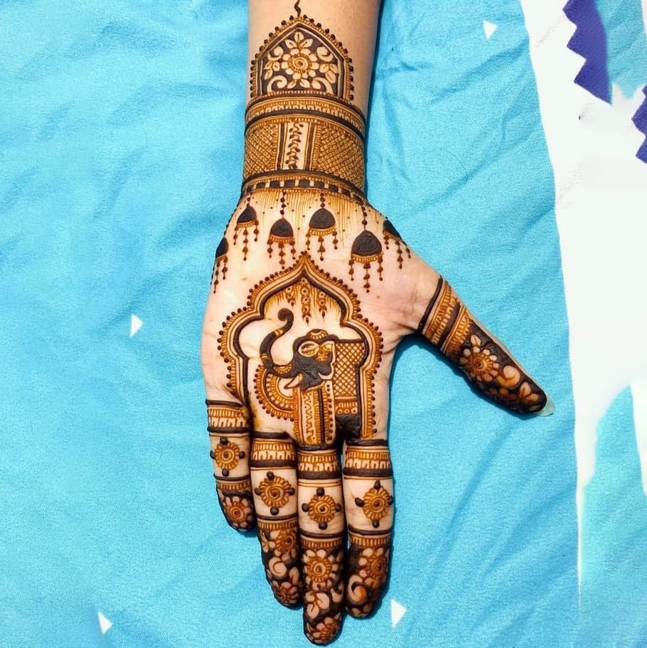 Festive mehndi design with symmetrical floral artwork