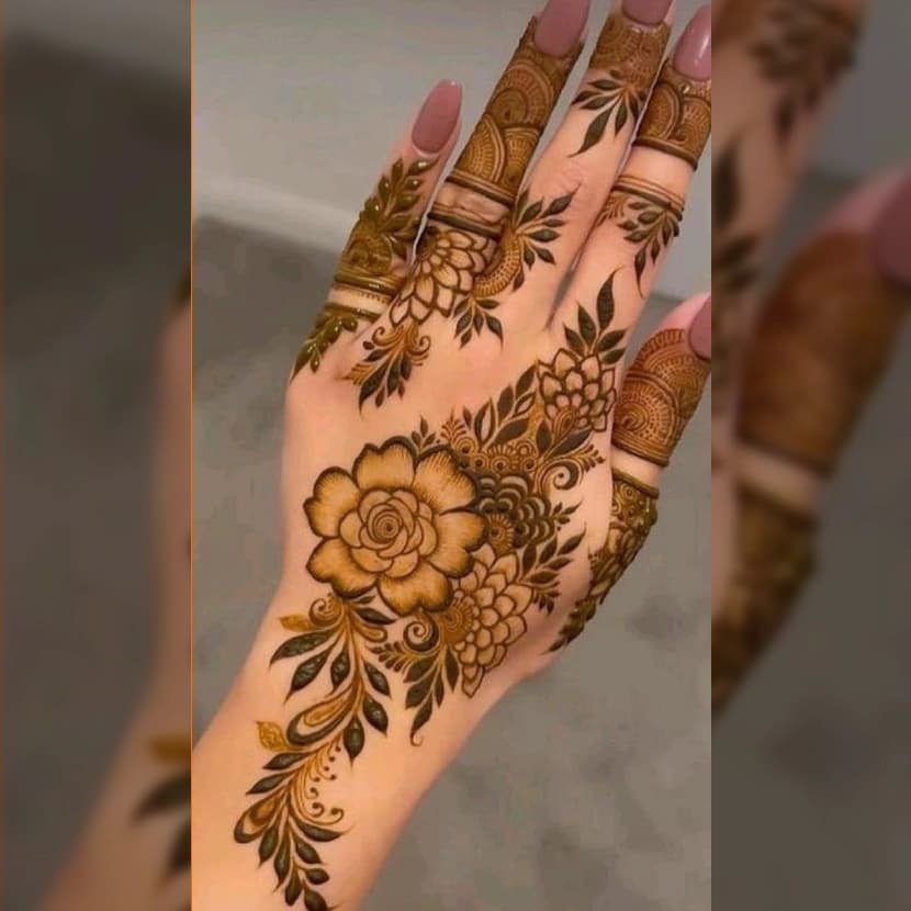 Traditional hand mehndi with elegant paisley and leaf motifs