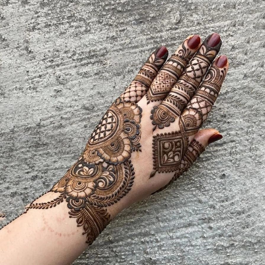 Beautiful festive mehndi design for the back hand